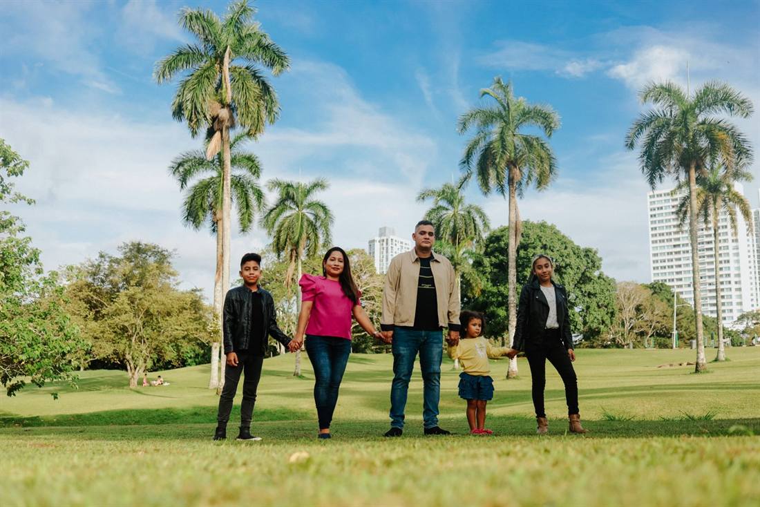 A Miami family outside their new home